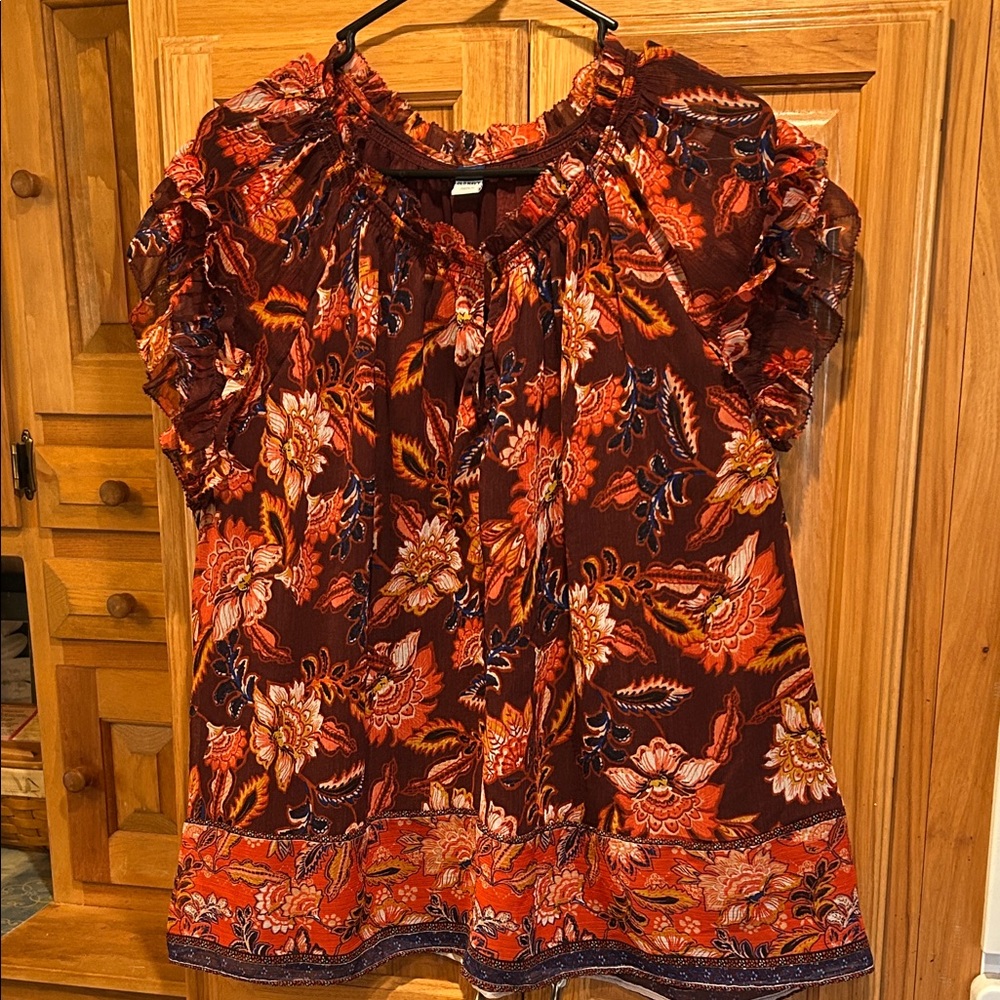 Old NavyPretty floral design top with maroon underlay with ruffled arm edging.